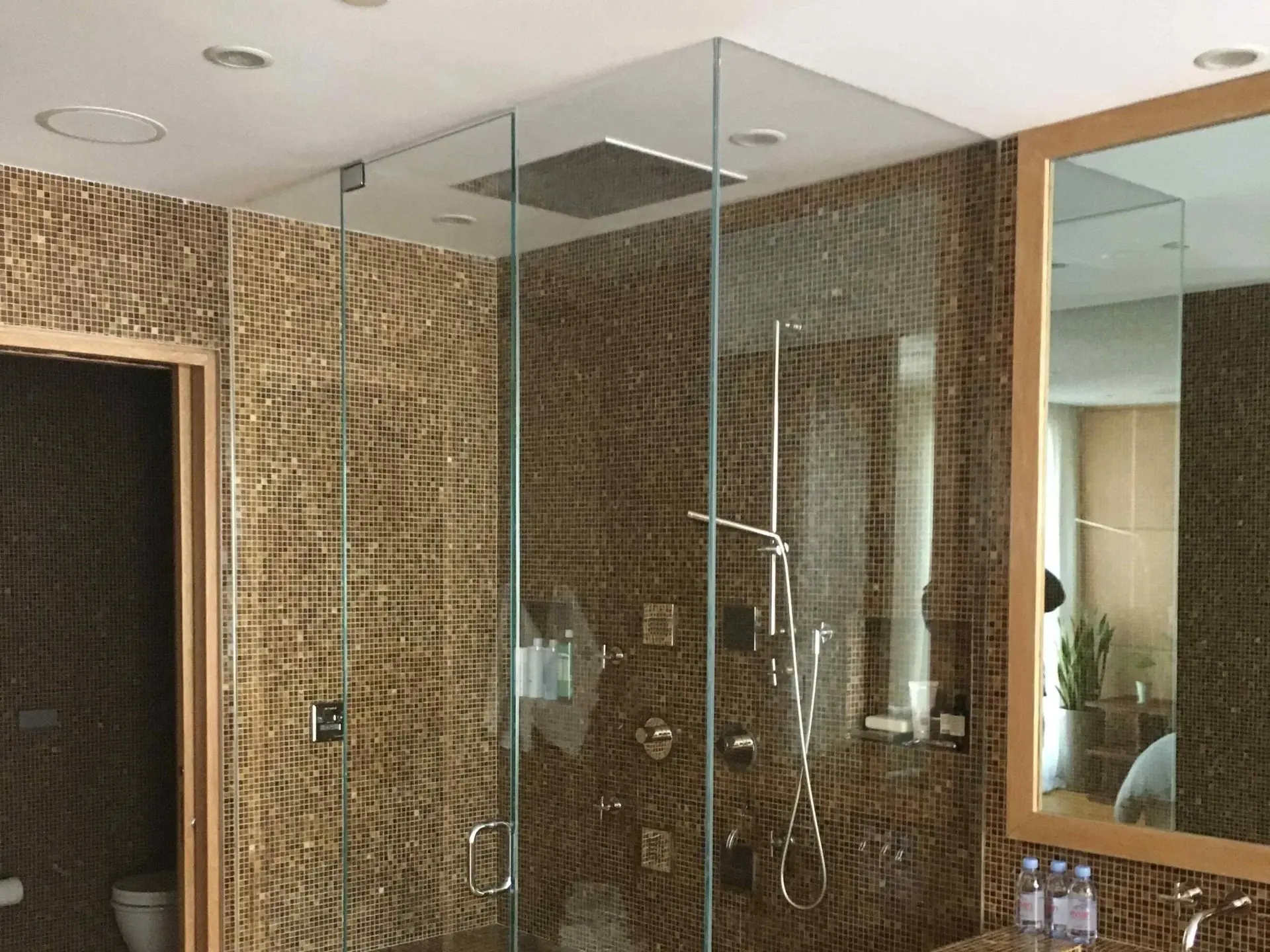 Shower enclosure with mosaic surround