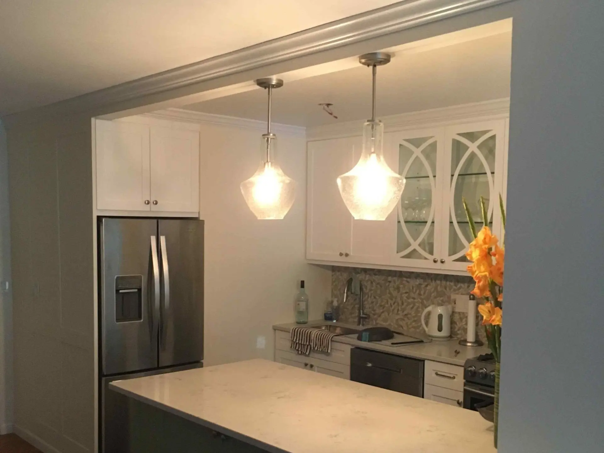 Kitchen with glass upper cabinets